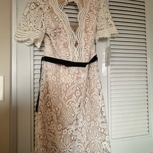 Elegant Lace Midi Dress with Black Trim